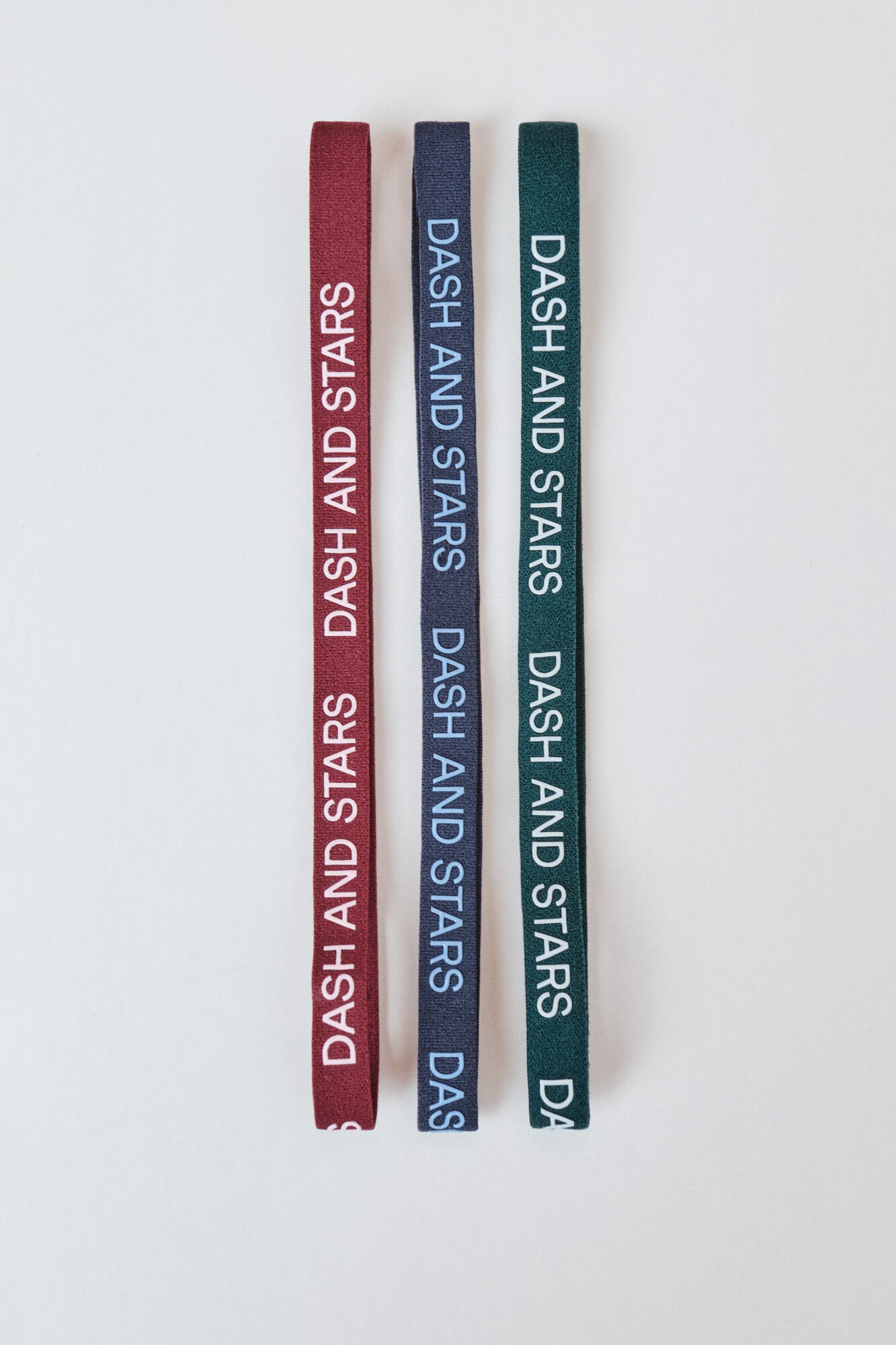 Dash and Stars Pack de 3 bandeletes el&aacute;sticas com logo verde